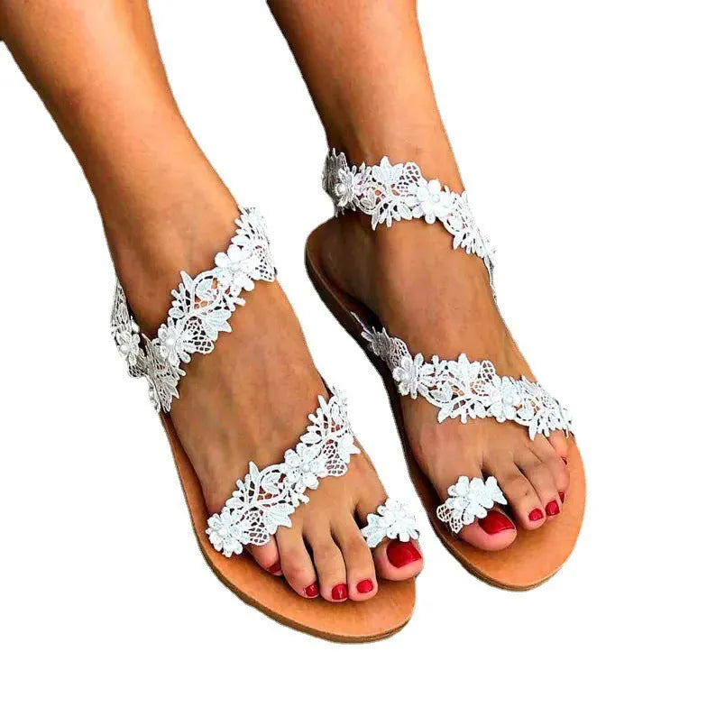 White women's flat sandals with rhinestone flower decoration and slip-on design