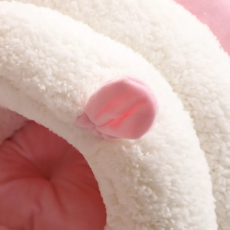 Closed round cat nest bed in blue, pink, or purple with soft plush interior and anti-skid bottom.