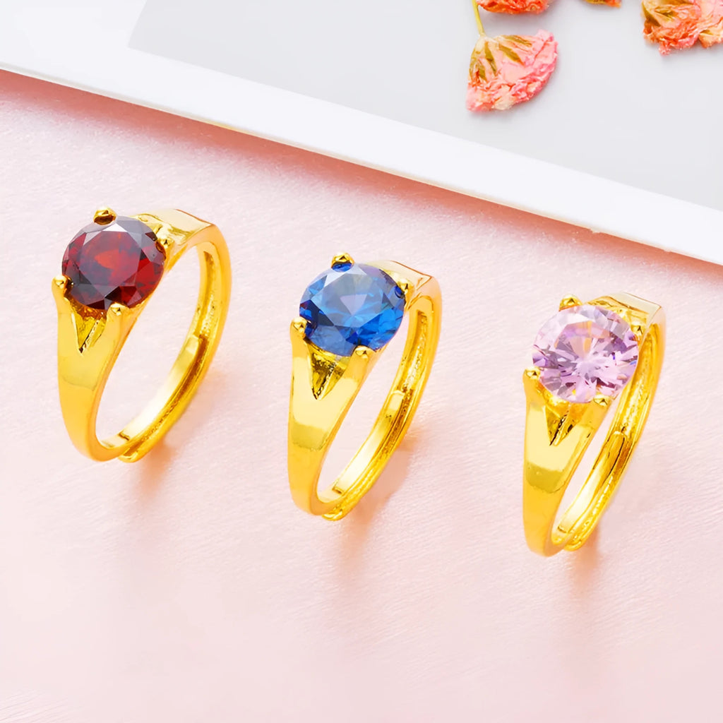 Women's adjustable copper ring with zircon stone in six colour options on a white background.
