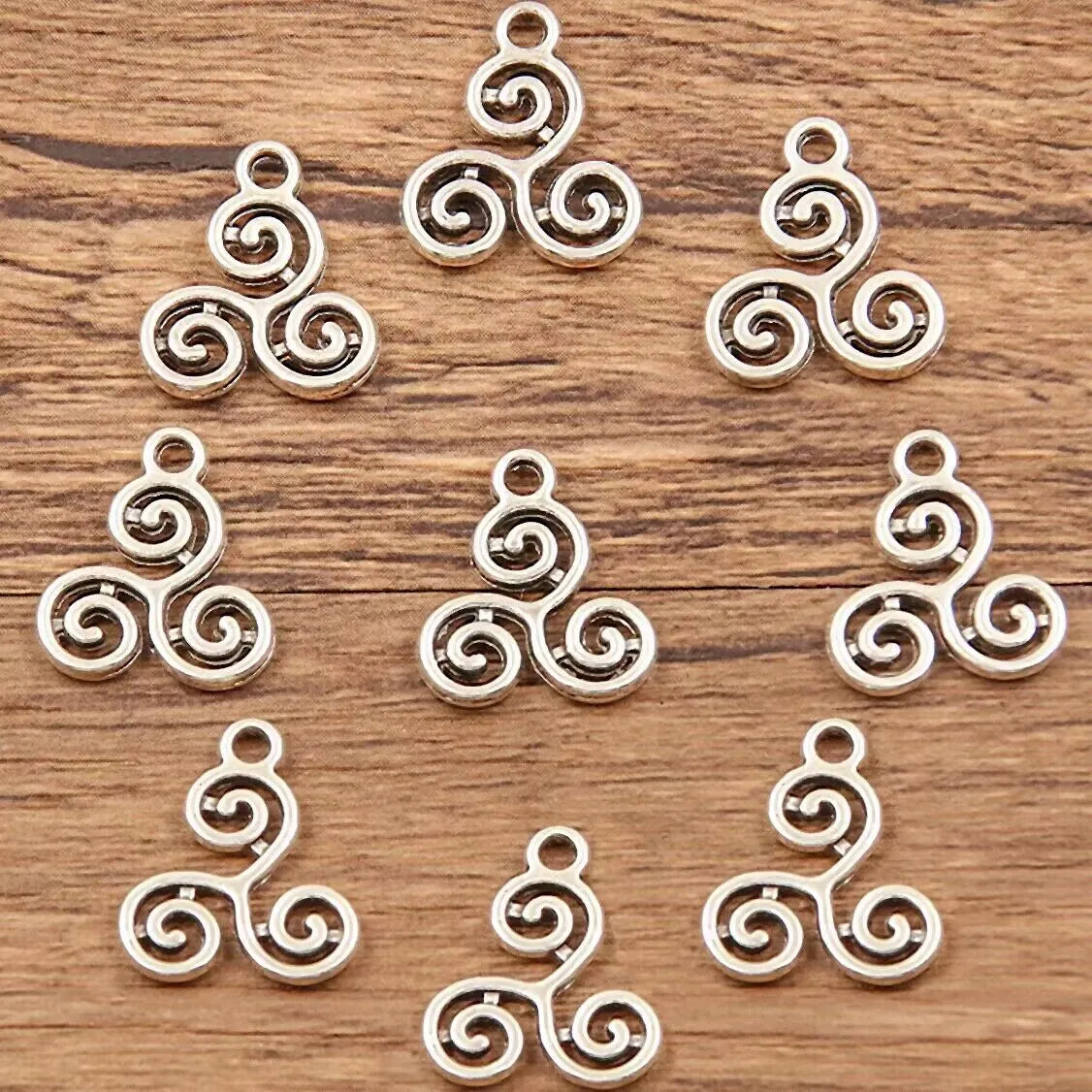 Double-sided hollow circle pendant in alloy with electroplated finish, simple round style, 7x11mm size on white background