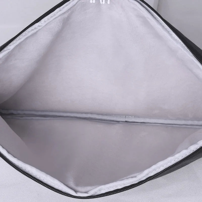 Light grey 15-inch computer liner bag with water-repellent polyester surface, slim 3cm profile