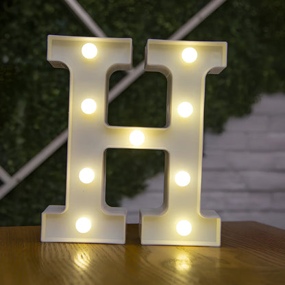 White plastic LED alphabet marquee sign with warm white illumination, 22cm height with battery operation