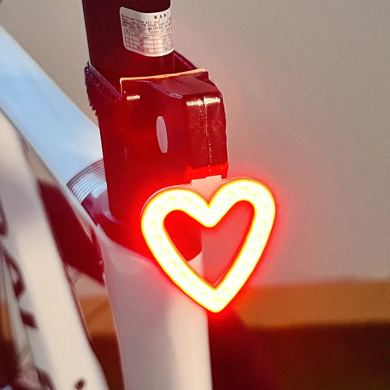 Rechargeable cartoon bicycle taillight in flower shape with flashing two-colour LEDs
