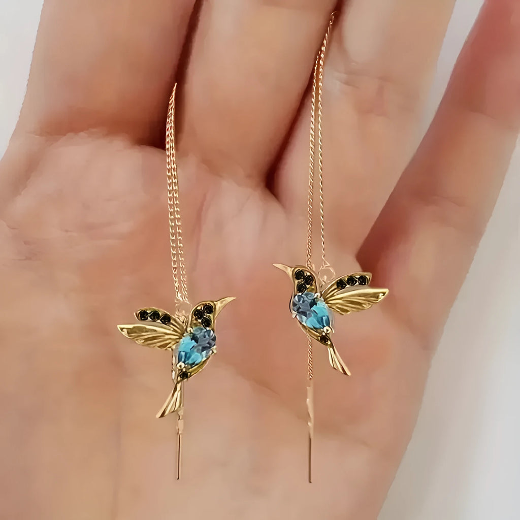 Long, dangling bird-shaped earrings with zirconium wing details in red, blue, and red lvzuan colour options.