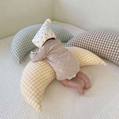 Moon-shaped baby nursing pillow in plaid cotton for newborns, available in yellow, green, and brown