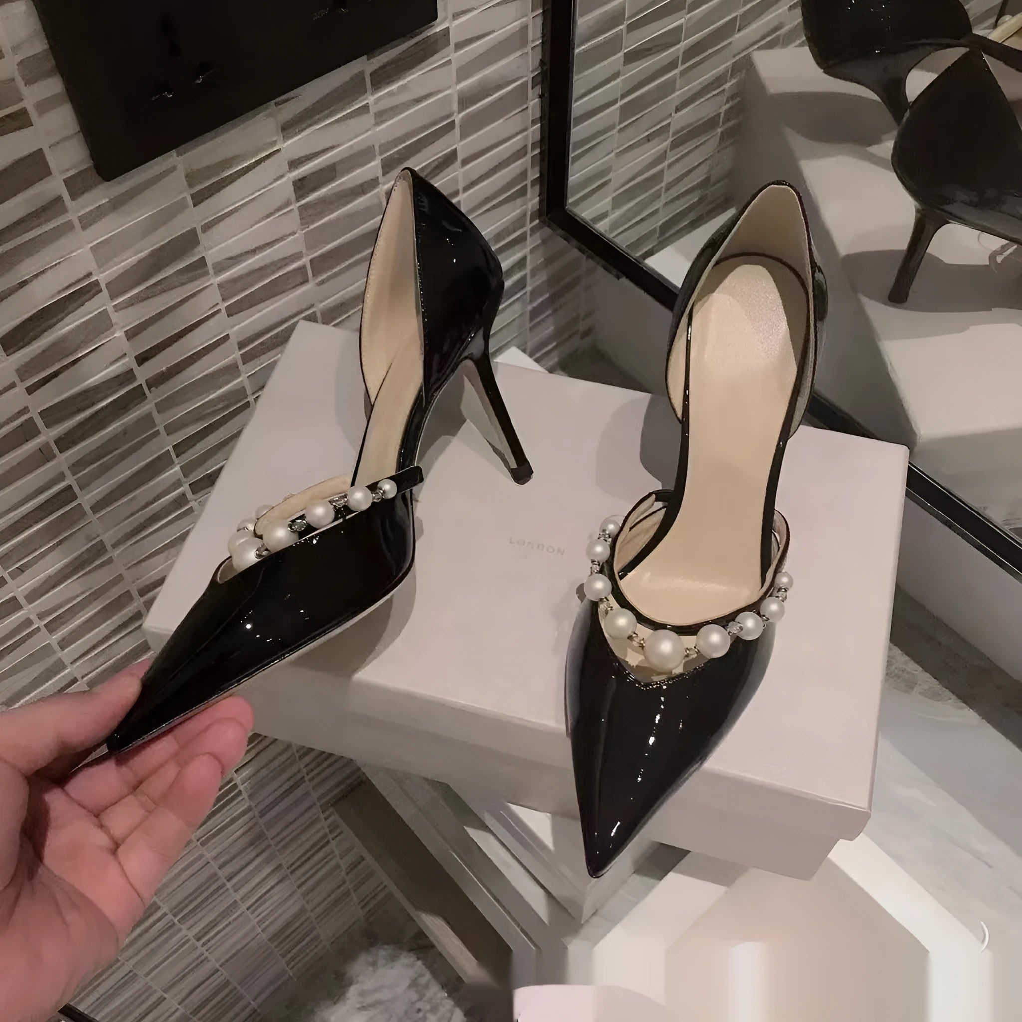 Women's black pointed patent leather high heel stiletto shoes with pearl decoration