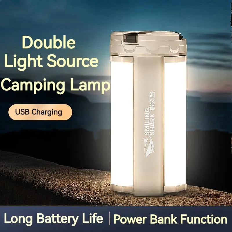 White cylindrical camping lamp with magnetic base and charging port showing LED light array