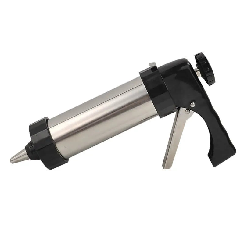 Stainless steel biscuit press gun with assorted cookie moulds and piping nozzles for baking.