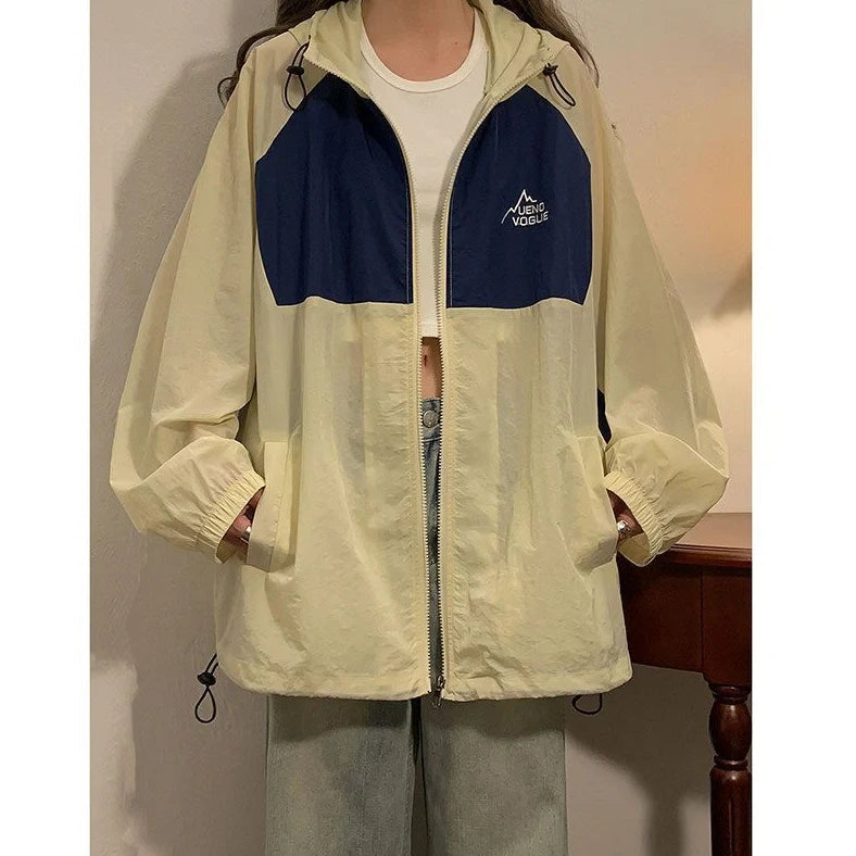 Women's summer sun protection top with raglan sleeves in apricot colour showing loose fit and splicing details