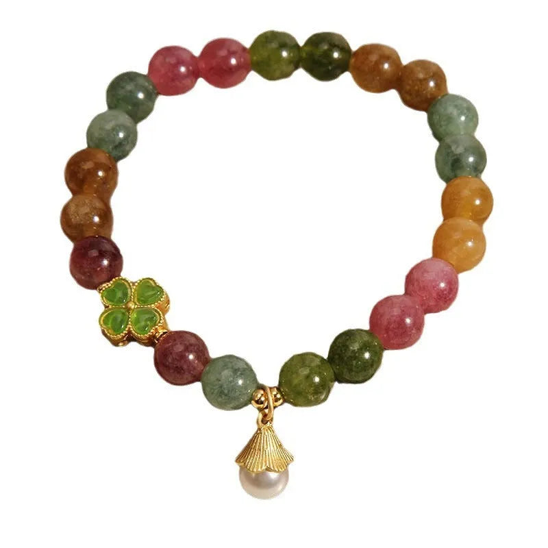 Coloured tourmaline bracelet with four-leaf clover pearl charm and geometric drop beads