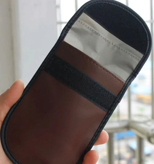 Black microfiber Faraday cage pouch for blocking car key fob and mobile phone signals.