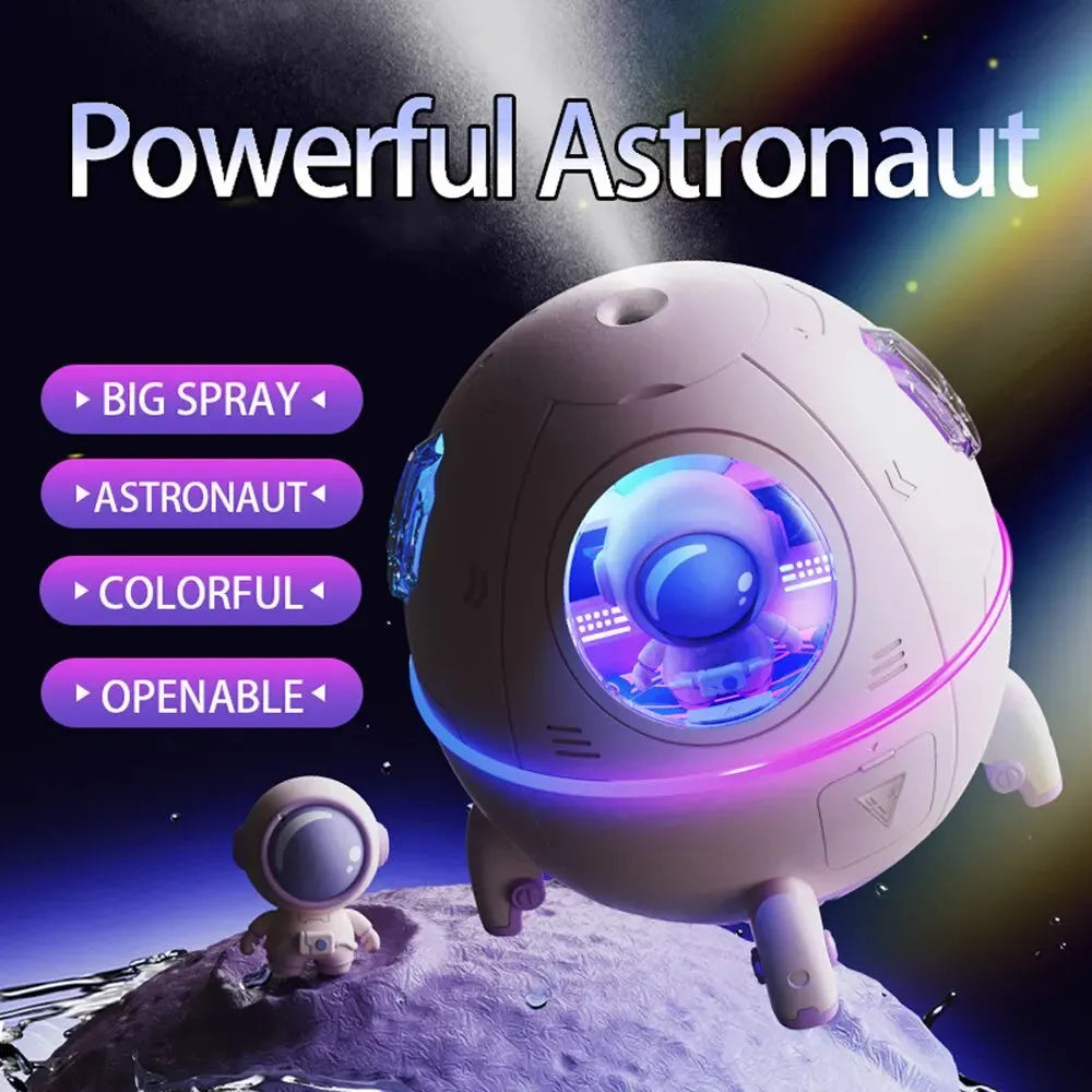 Astronaut-shaped USB desktop humidifier with colourful LED light on a desk.