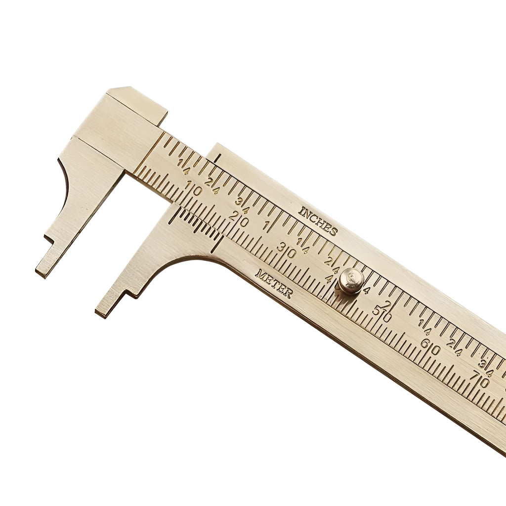 Double scale mini copper caliper with brass body, 100mm range, showing dual metric and imperial scales