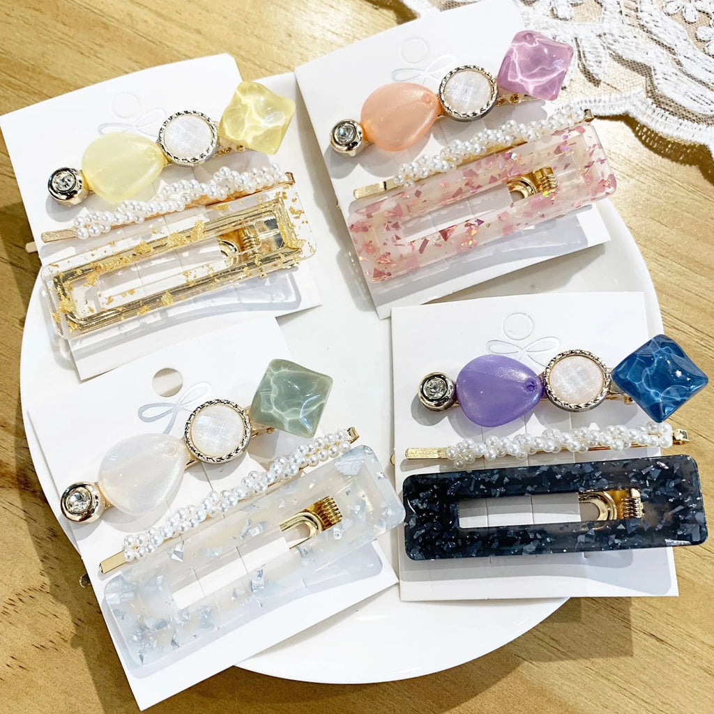 Acrylic pearl hair clip set in various colours including blue, green, pink, purple, white, and yellow