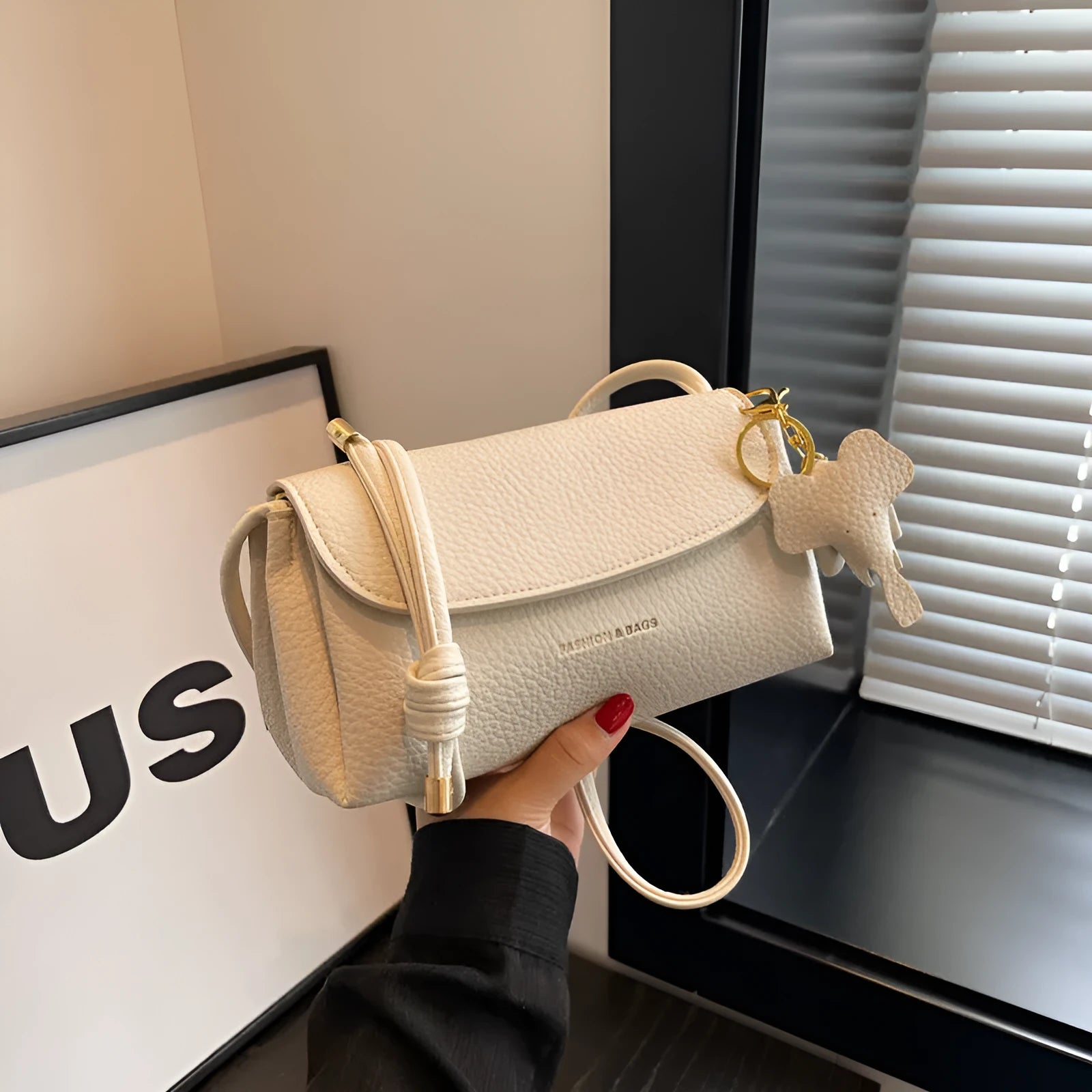 Soft PU leather small shoulder bag in khaki, pillow shape, 21cm width, with visible sewing thread details