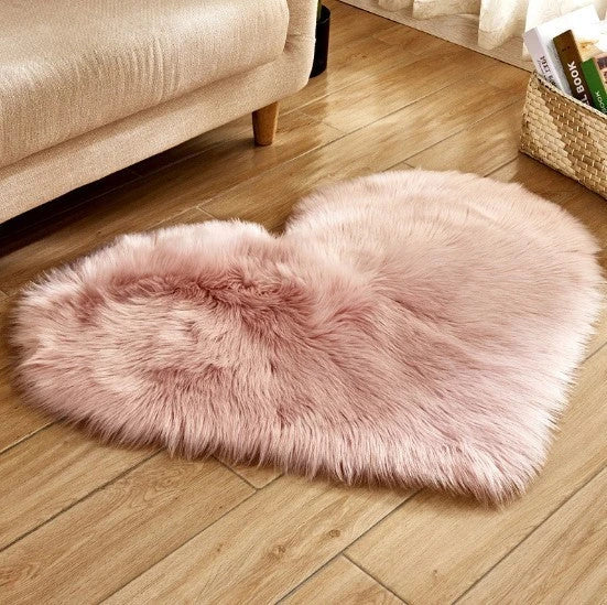 Soft, plush heart-shaped rug in various colors and sizes for comfortable home decor