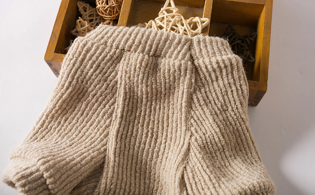 Brown knitted dog sweater jumper on a small dog, showing casual pullover design.