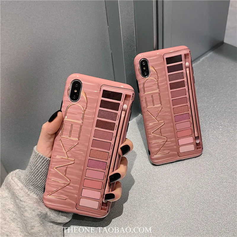 Flesh and grey silicone phone case for various iPhone models on a table.