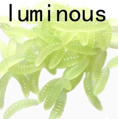 50 artificial maggot fishing lures showing segmented body design and colour variations