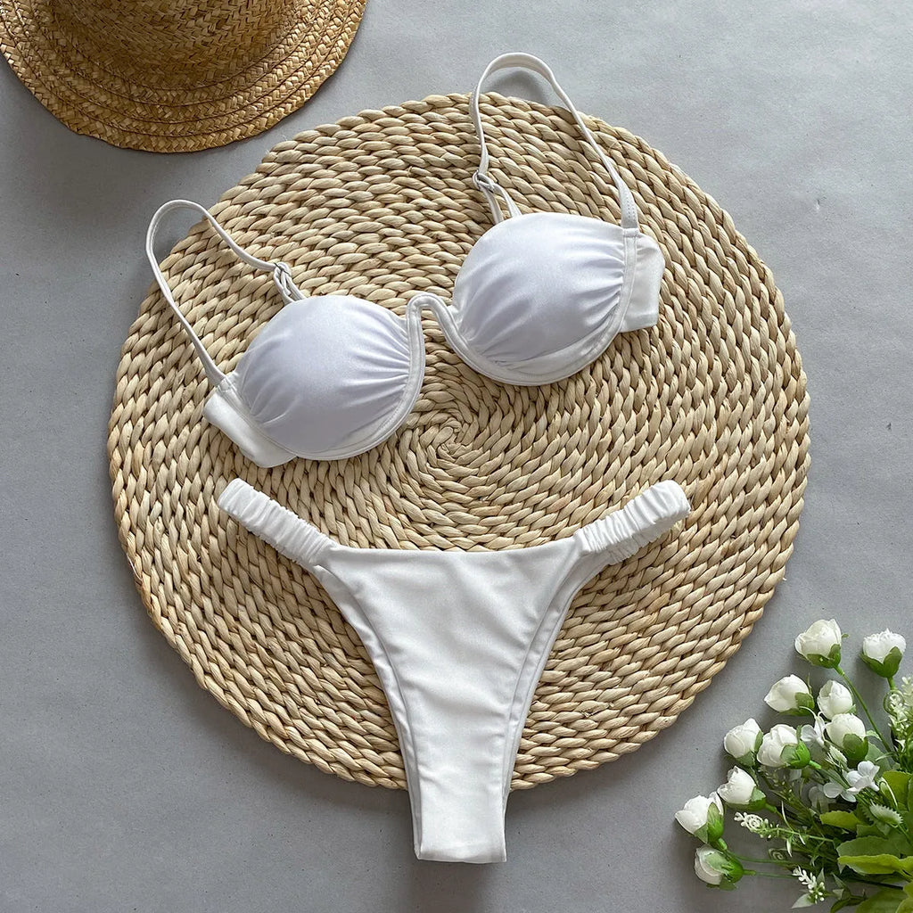 Women's black underwire bikini top and briefs set made from high elasticity nylon fabric.