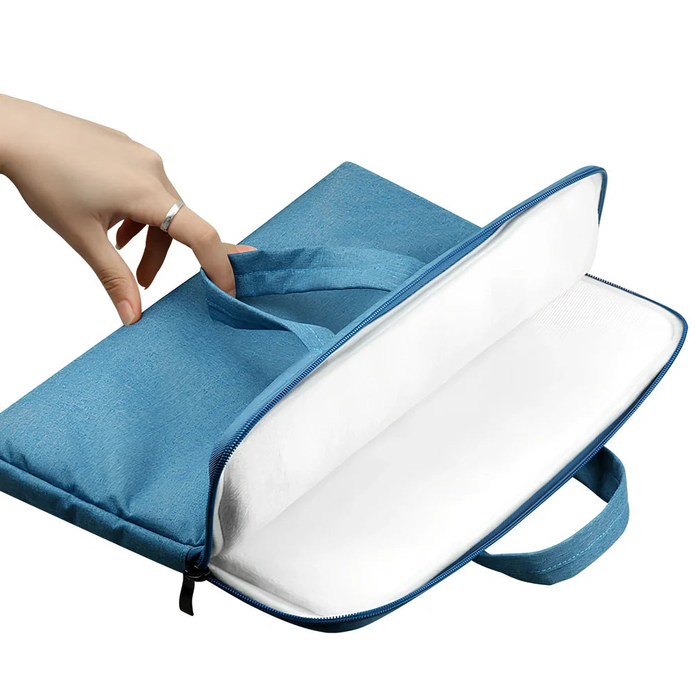 Grey laptop sleeve for MacBook with ant cloth exterior and soft handle, showing internal plush lining