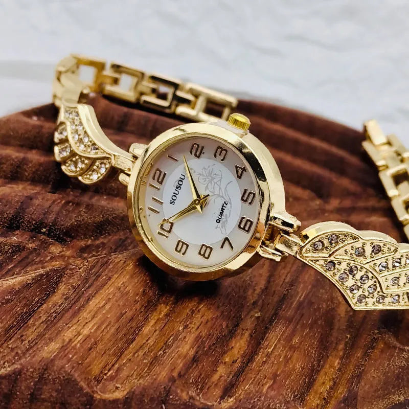 Stainless steel women's watch with round dial on a metal strap with Vachette clasp, shown in gold colour.