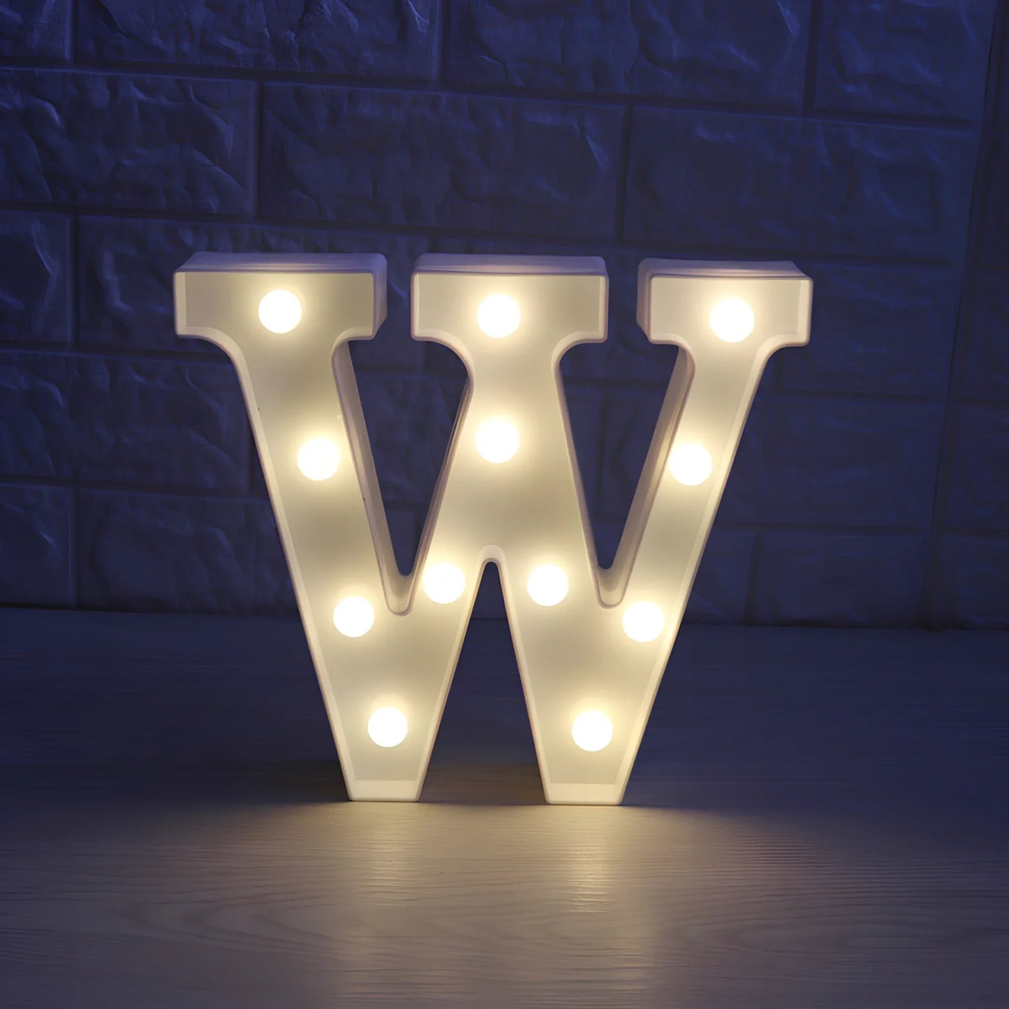 White plastic LED alphabet marquee sign with warm white illumination, 22cm height with battery operation