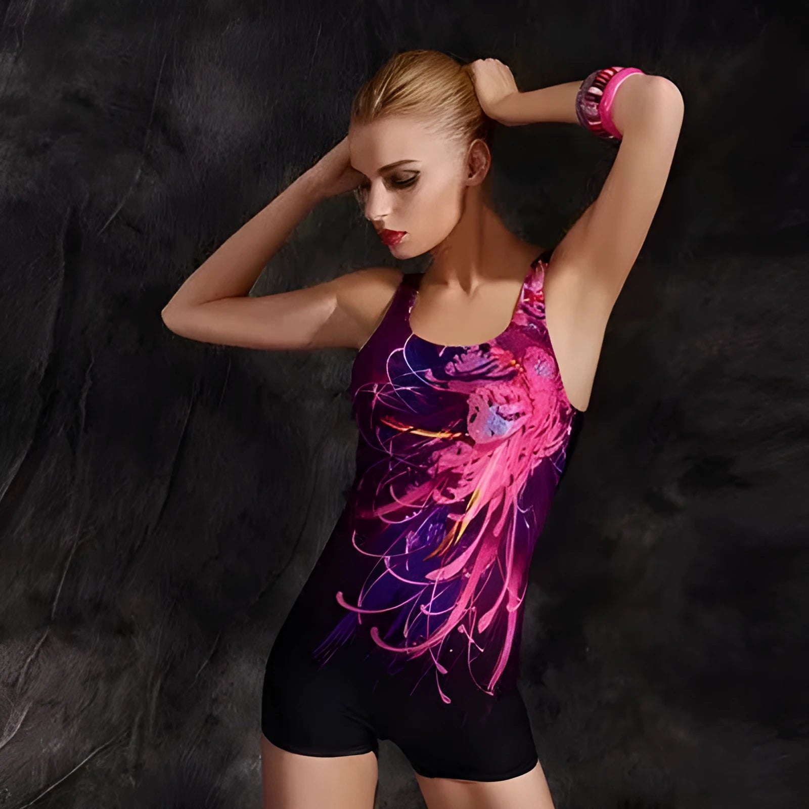 Women's black and blue one-piece swimsuit with sleeveless, conservative design on a mannequin.