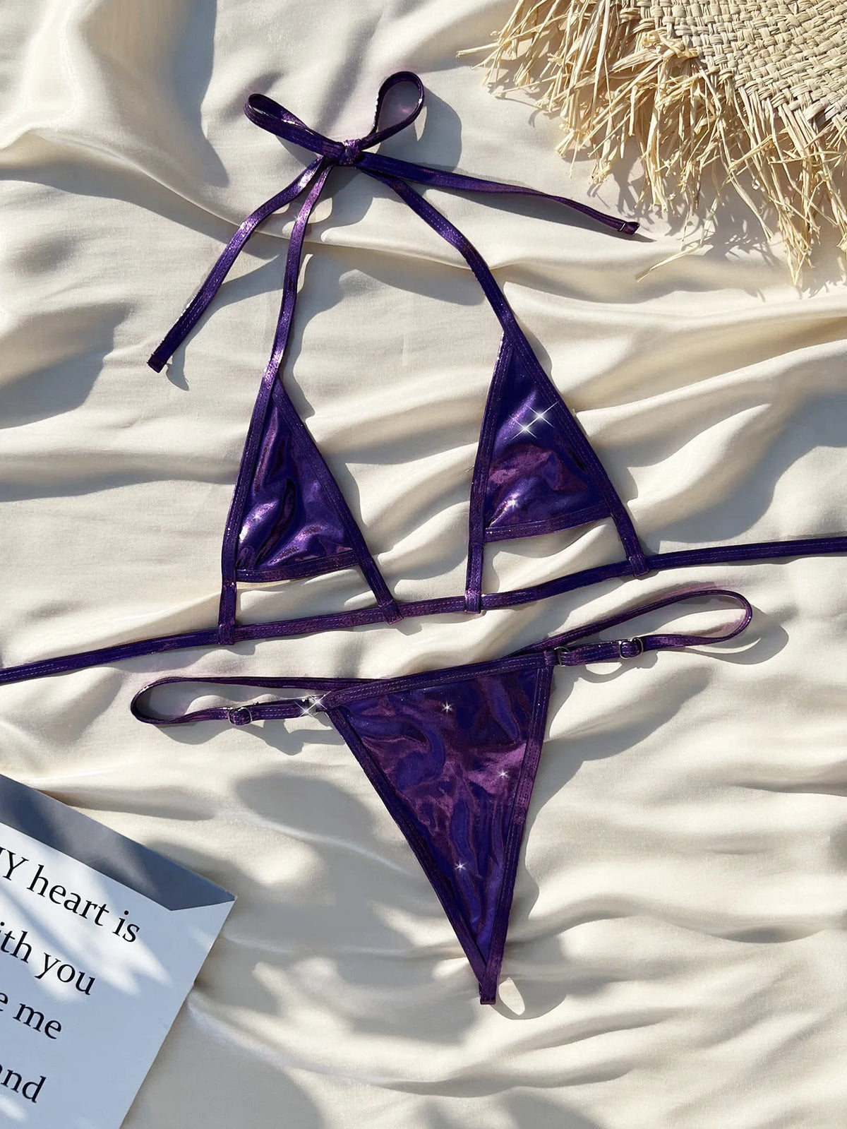 Purple metal pearlescent lace-up micro bikini on female model, split sides, polyester swimwear set