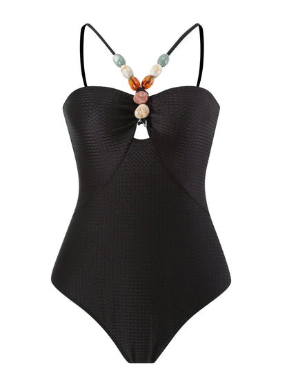 Women's one-piece swimsuit with hollow gem sling design in sapphire blue colour