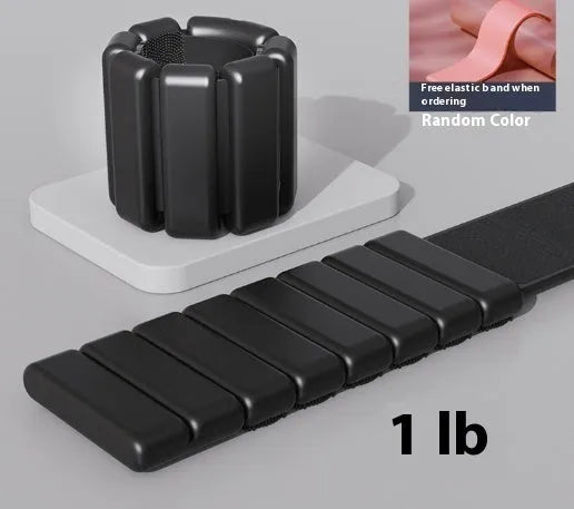 Black detachable silicone weight bracelet with Velcro fastener and a 2lb weight pod.