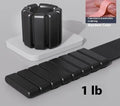 Black detachable silicone weight bracelet with Velcro fastener and a 2lb weight pod.
