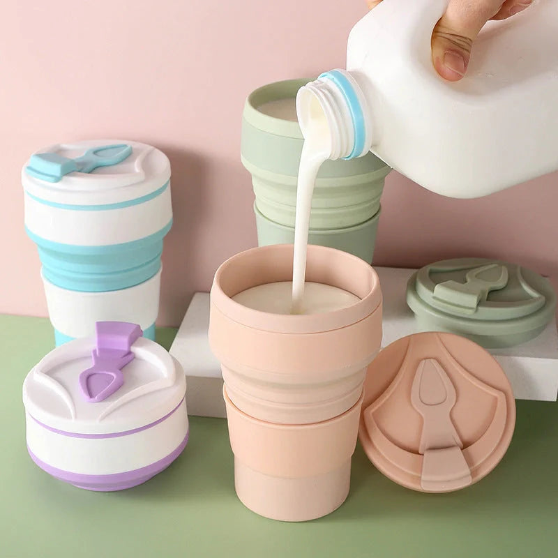 Collapsible silicone travel mug with leak-proof cover in various colours