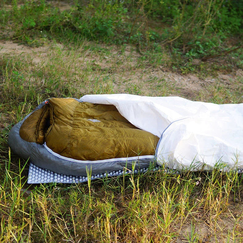 White rectangular camping sleeping bag made from DuPont TYVEK material showing 230cm length dimensions