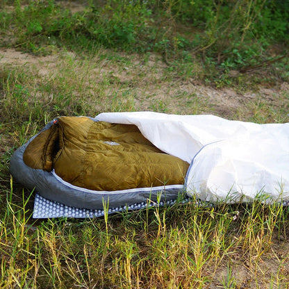 White rectangular camping sleeping bag made from DuPont TYVEK material showing 230cm length dimensions