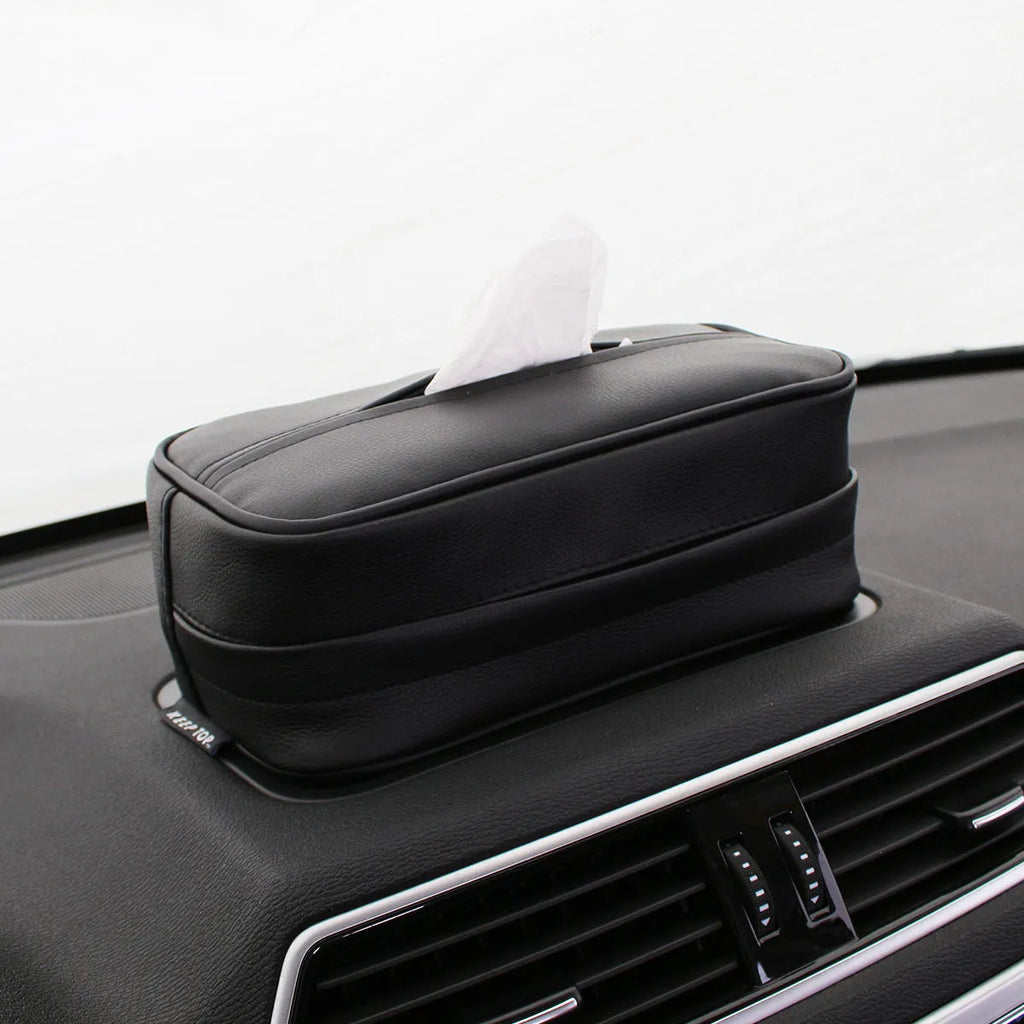 Black PU leather hanging storage box with paper bag design, shown suspended.