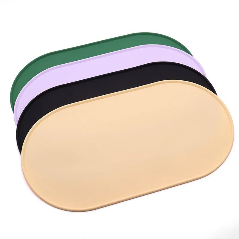 Silicone waterproof placemat for cat bowls in green, beige, black, or purple colour.