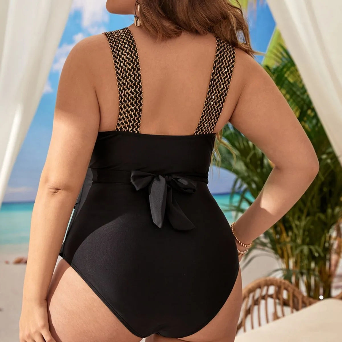 Women's plus size black one piece sleeveless swimsuit with chest pad on a mannequin.