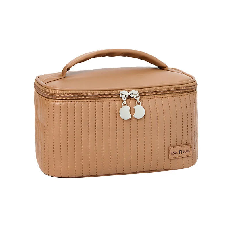 Open-top cake-shaped women's makeup bag in PU leather, shown in a choice of solid colours.