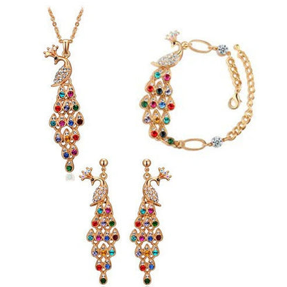 Creative Crystal Peacock Bridal Jewelry Set showing earrings, necklace, and bracelet with alloy construction and crystal accents