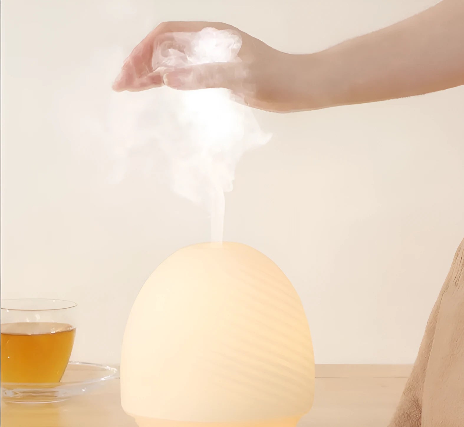 Asakusa threaded glass aroma diffuser in frosted white on a table with a single fog outlet