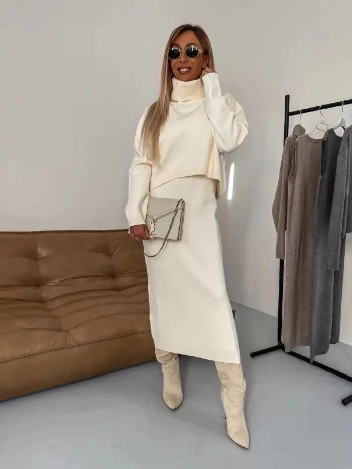Women's winter fashion two-piece set featuring a turtleneck pullover and sleeveless long dress in white, grey, or camel.