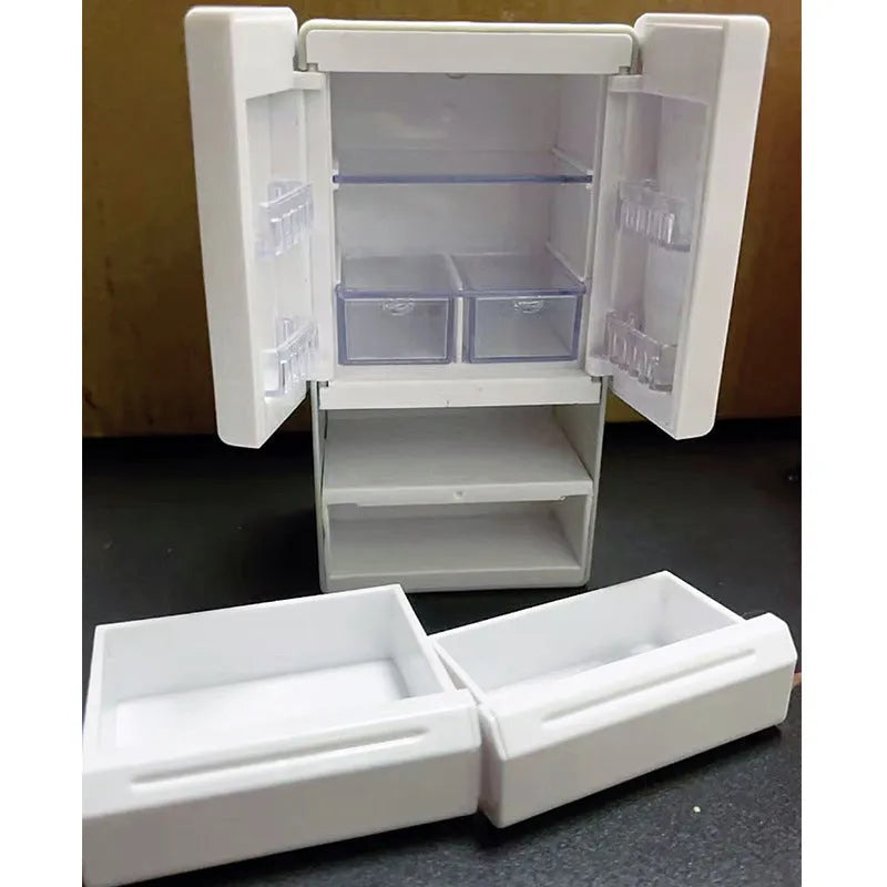 White plastic miniature candy toy model with illuminated light feature on a display surface.
