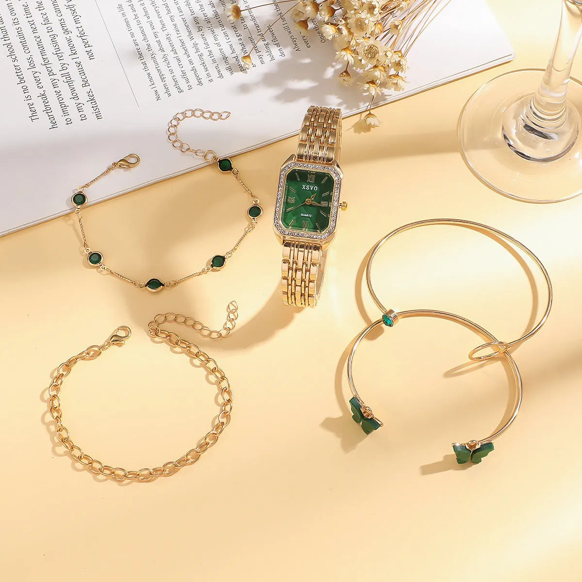 Gold green women's square watch with four matching bracelets showing 25mm dial and jewellery buckle