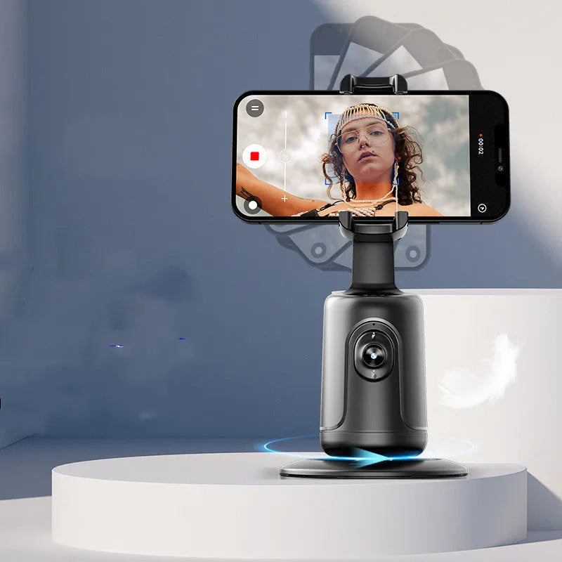 New automatic tracking stabiliser in dark black ABS plastic with 360-degree rotation on a desktop, USB cable attached