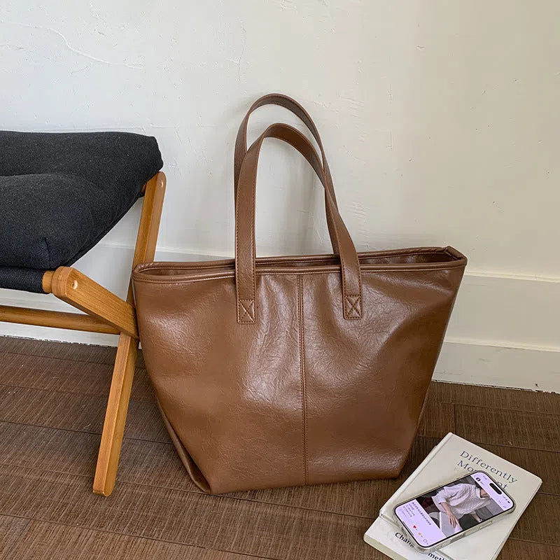 Fashionable large-capacity vintage tote bag in soft PU with stitched seams, horizontal shape, double straps