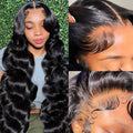 A black, medium-long curly wave full-head synthetic wig for ladies on a stand.