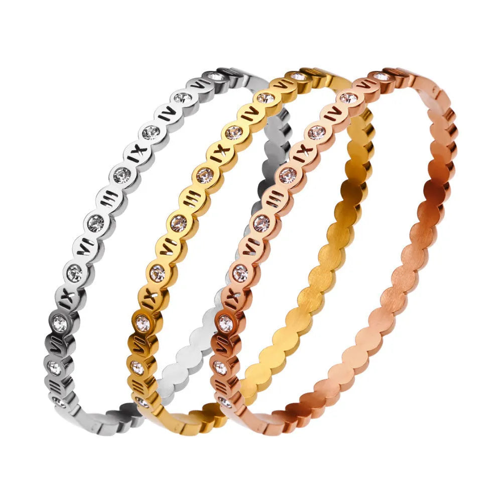 Korean style titanium steel bracelet with an adjustable number charm in gold, rose gold, or steel colour.