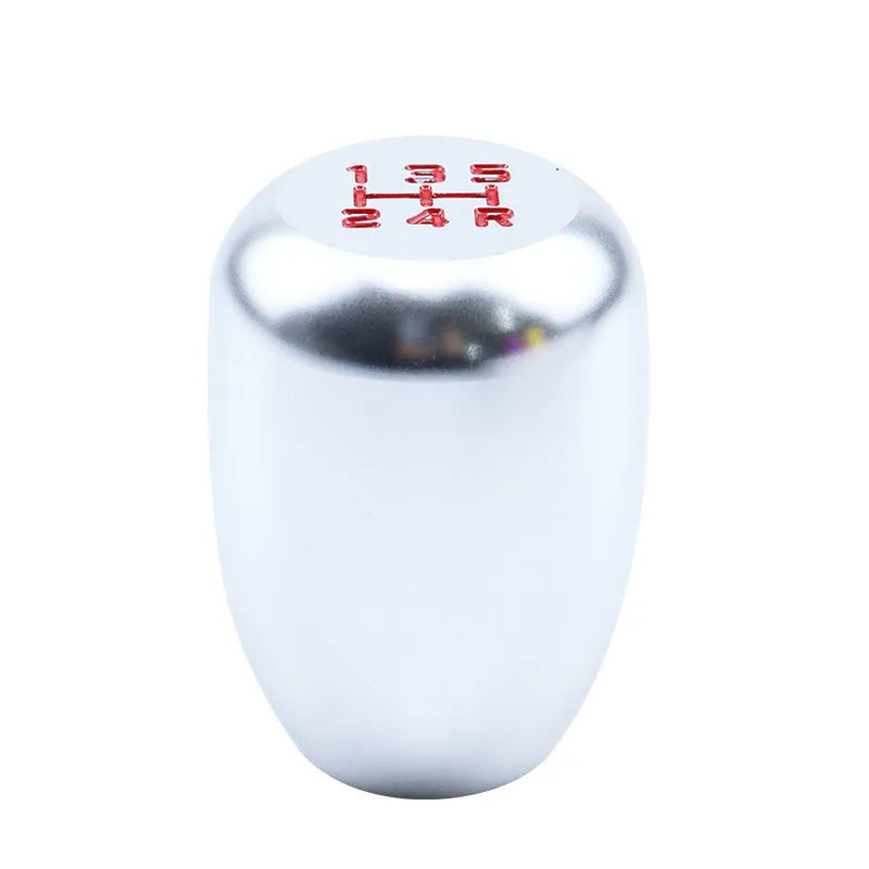 Universal aluminium alloy car gear shift knob with three rubber adaptor sleeves in sizes 8mm, 10mm, and 12mm.