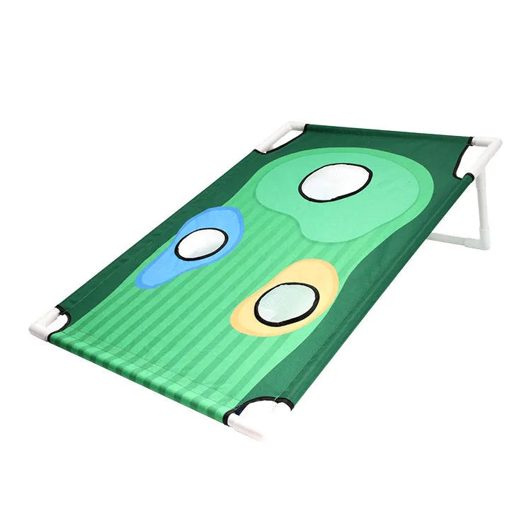 Green golf swing practice net with PVC frame and Oxford cloth target set up outdoors with balls and mat